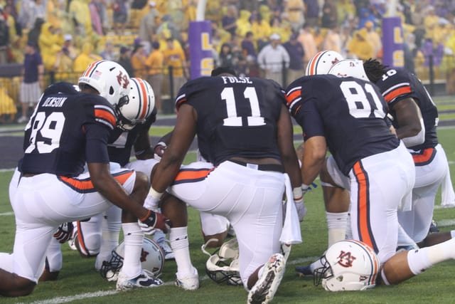 Auburn Tigers take a knee for a pre-game prayer